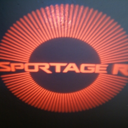 Подсветка логотипа в двери SPORTAGE,подсветка дверей с логотипом SPORTAGE,Штатная подсветка SPORTAGE,подсветка дверей с логотипом авто SPORTAGE,светодиодная подсветка логотипа SPORTAGE в двери,Лазерные проекторы SPORTAGE в двери,Лазерная подсветка SPORTAG